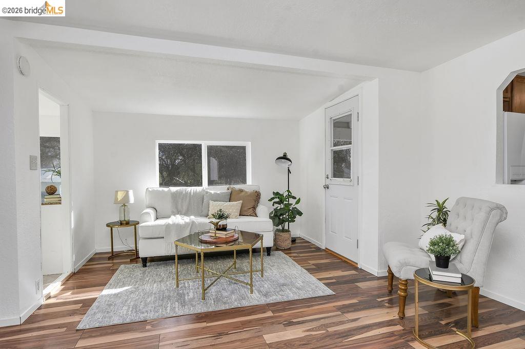 7550 Adams Road Valley Springs, CA 95252 - Photo 9 of 38 Living room with wood finished floors and arched walkways