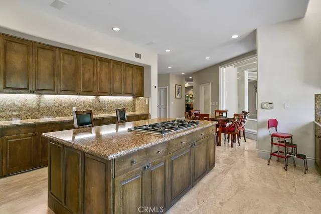 a kitchen with stainless steel appliances granite countertop a stove and a sink