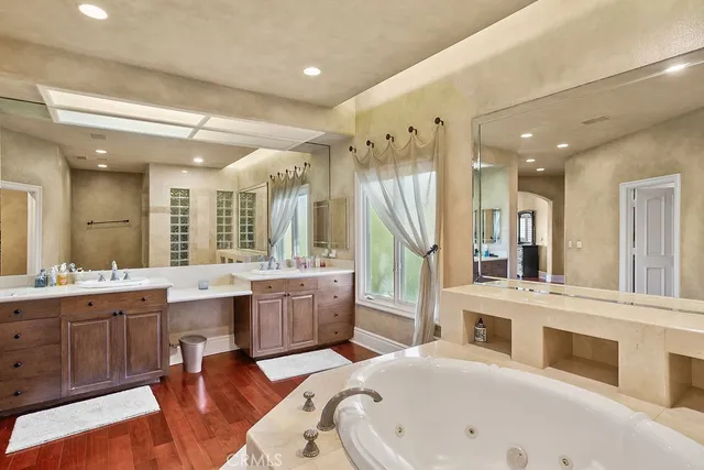 a large white kitchen with a large window