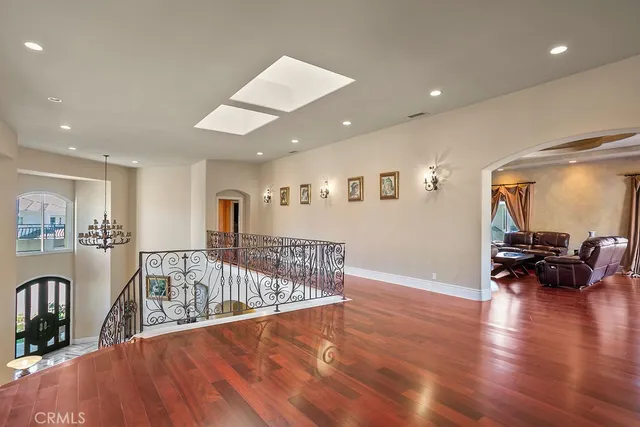 a view of a livingroom with furniture hardwood floor and a view of living room