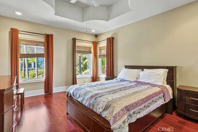a bedroom with a large bed and a large window