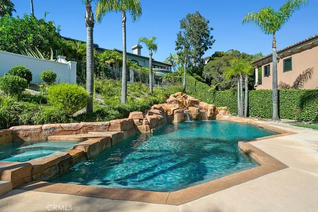 a view of a garden with a house