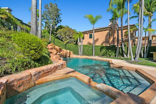 a backyard of a house with a garden and outdoor seating