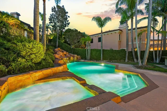 a view of a backyard with swimming pool