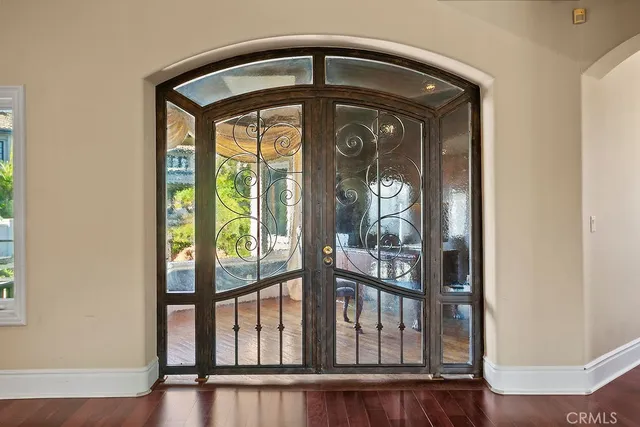 a view of a door and wooden floor