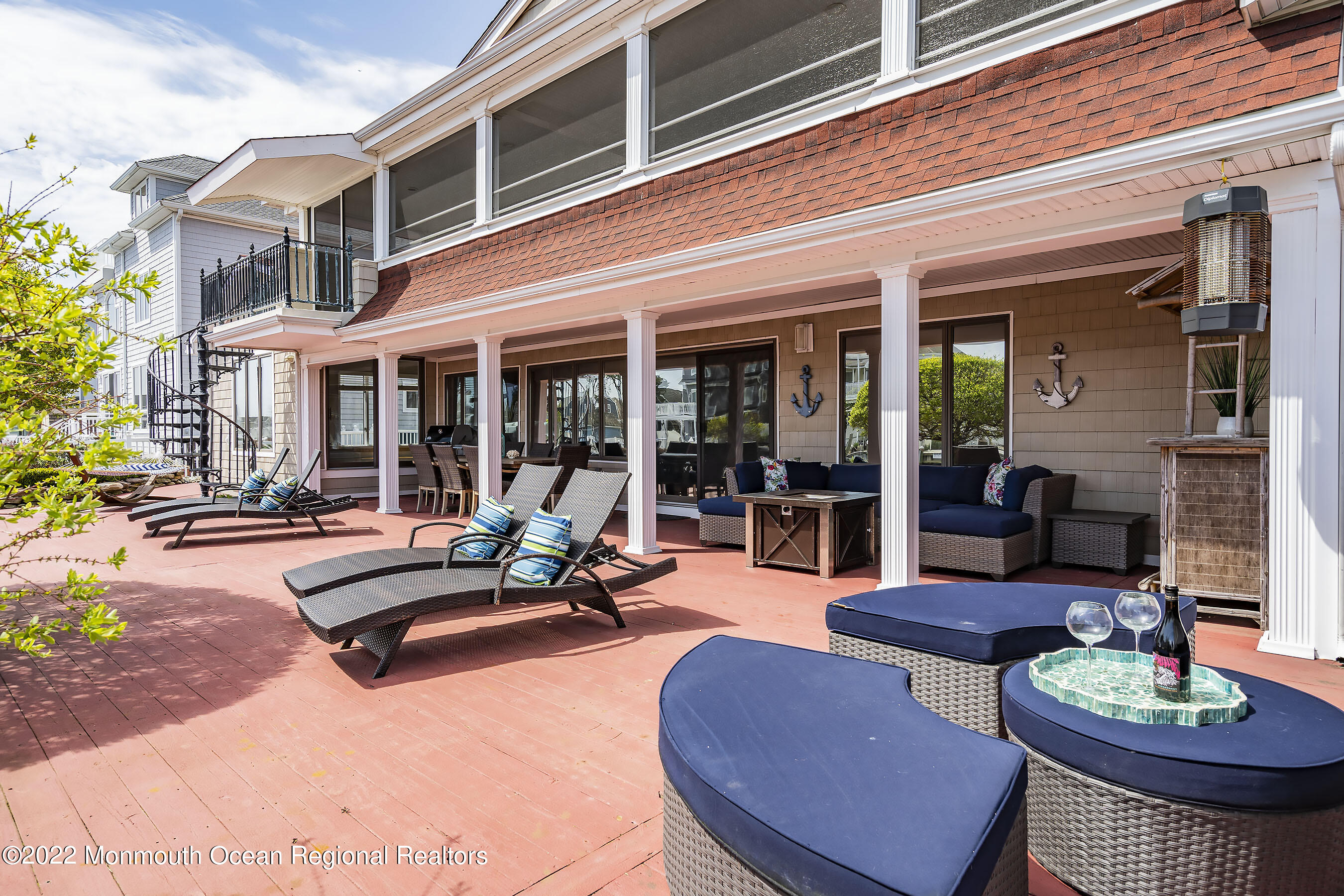 44 Mermaid Road Toms River, NJ 08753 - Photo 12 of 63 a view of a patio with couches table and chairs and potted plants