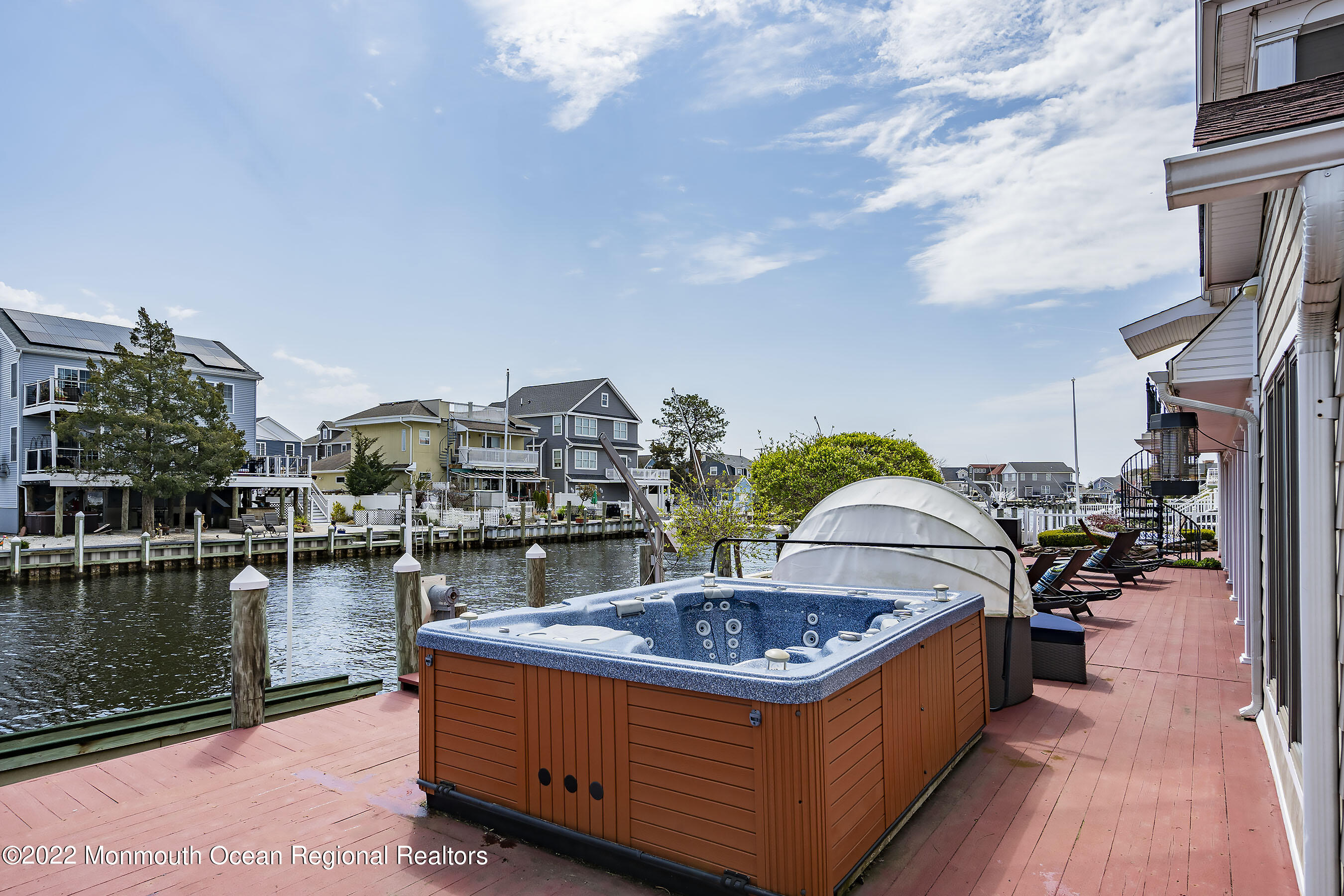 44 Mermaid Road Toms River, NJ 08753 - Photo 15 of 63 a view of a swimming pool with a lounge chairs