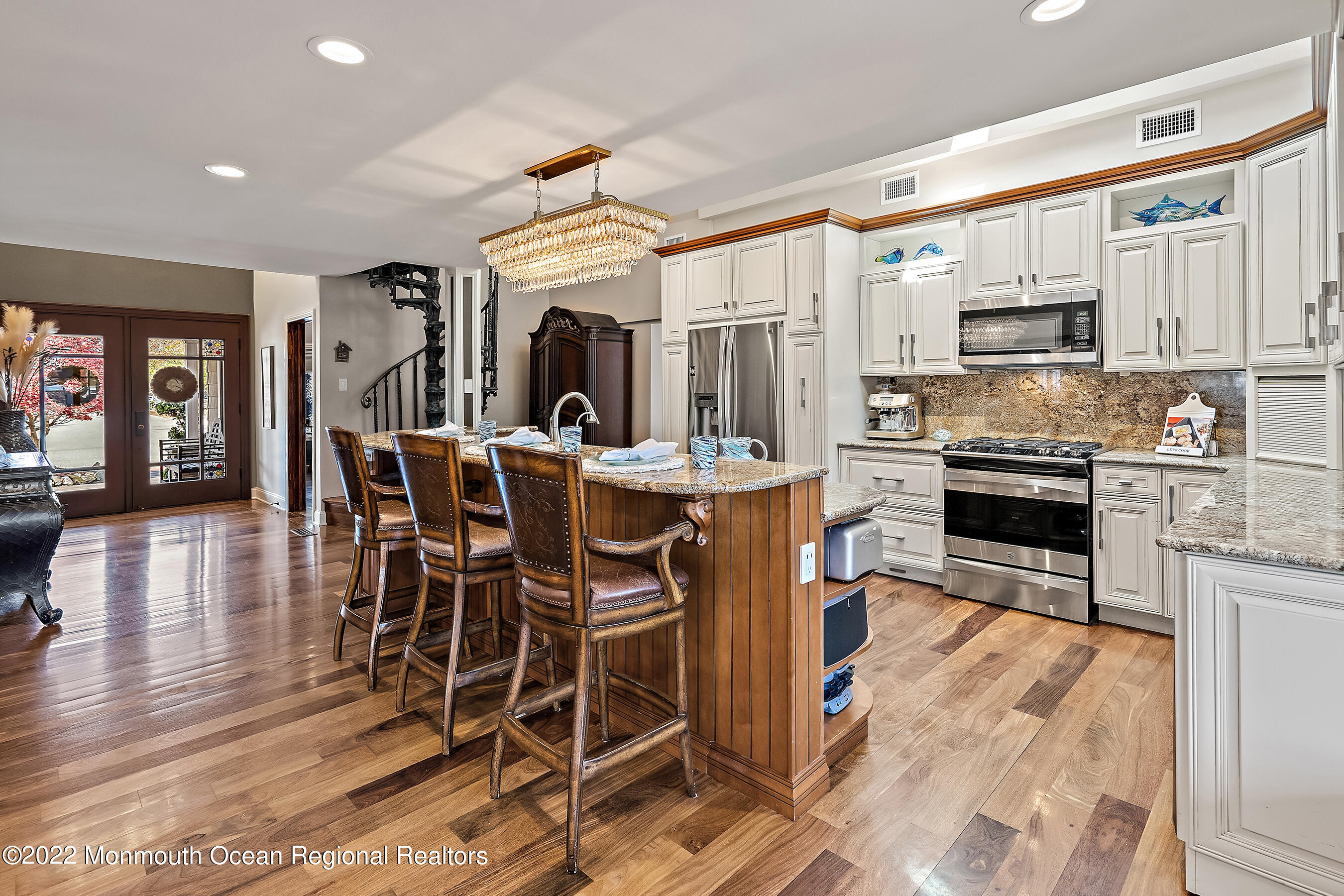44 Mermaid Road Toms River, NJ 08753 - Photo 21 of 63 a kitchen with stainless steel appliances kitchen island granite countertop a dining table chairs and granite counter tops