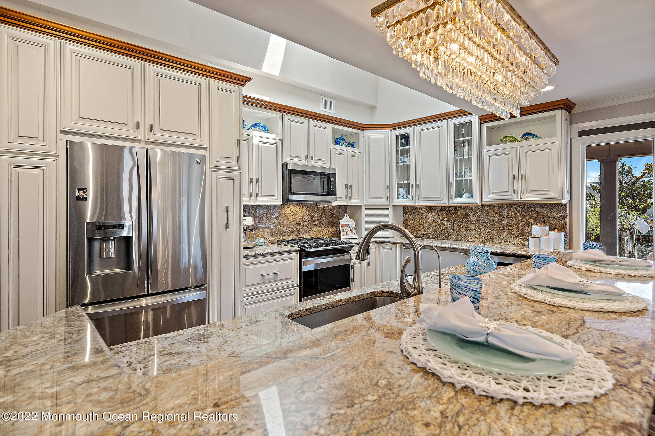 44 Mermaid Road Toms River, NJ 08753 - Photo 23 of 63 a kitchen with granite countertop a refrigerator and a stove top oven