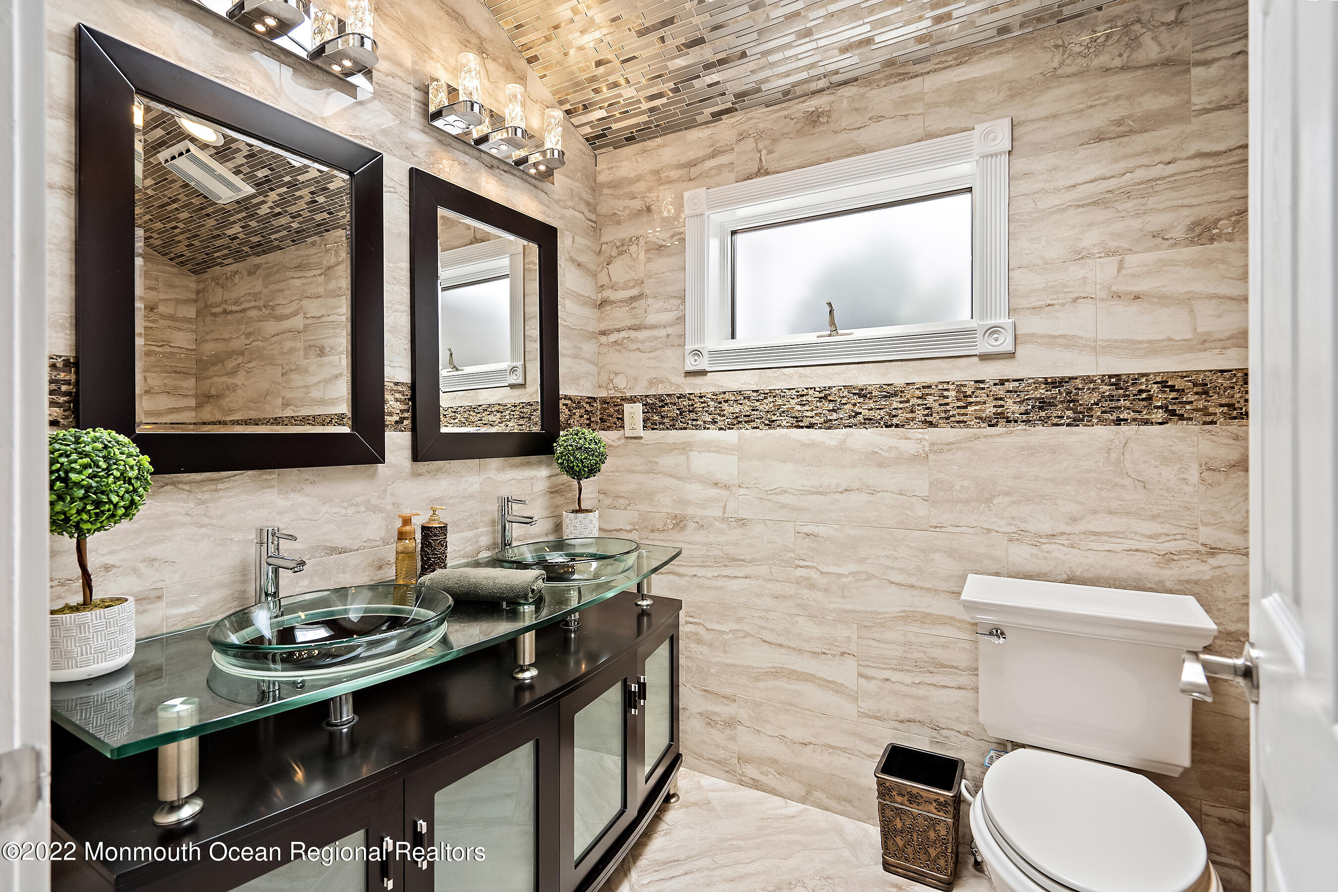 44 Mermaid Road Toms River, NJ 08753 - Photo 55 of 63 a bathroom with a toilet sink and mirror