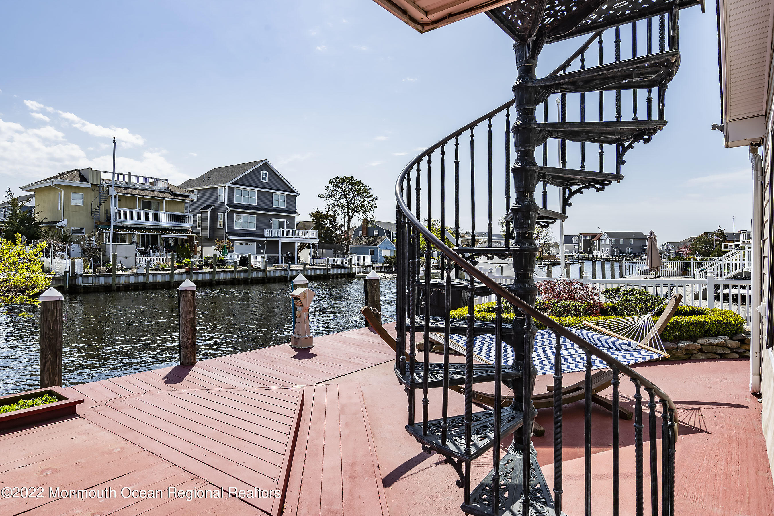 44 Mermaid Road Toms River, NJ 08753 - Photo 9 of 63 a balcony view with two chairs and a table