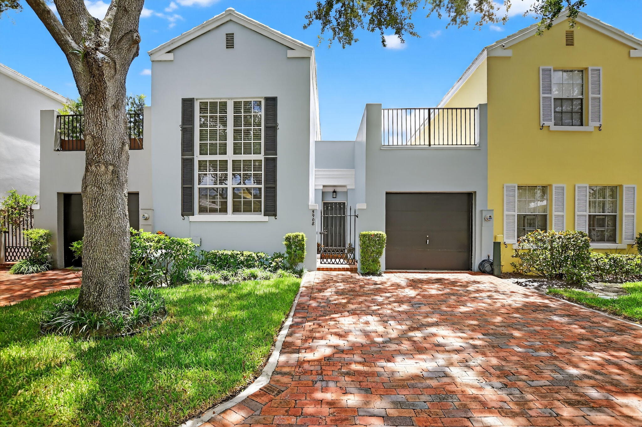 5908 Catesby Street Boca Raton, FL 33433 - Photo 1 of 49 a front view of a house with a yard and garage