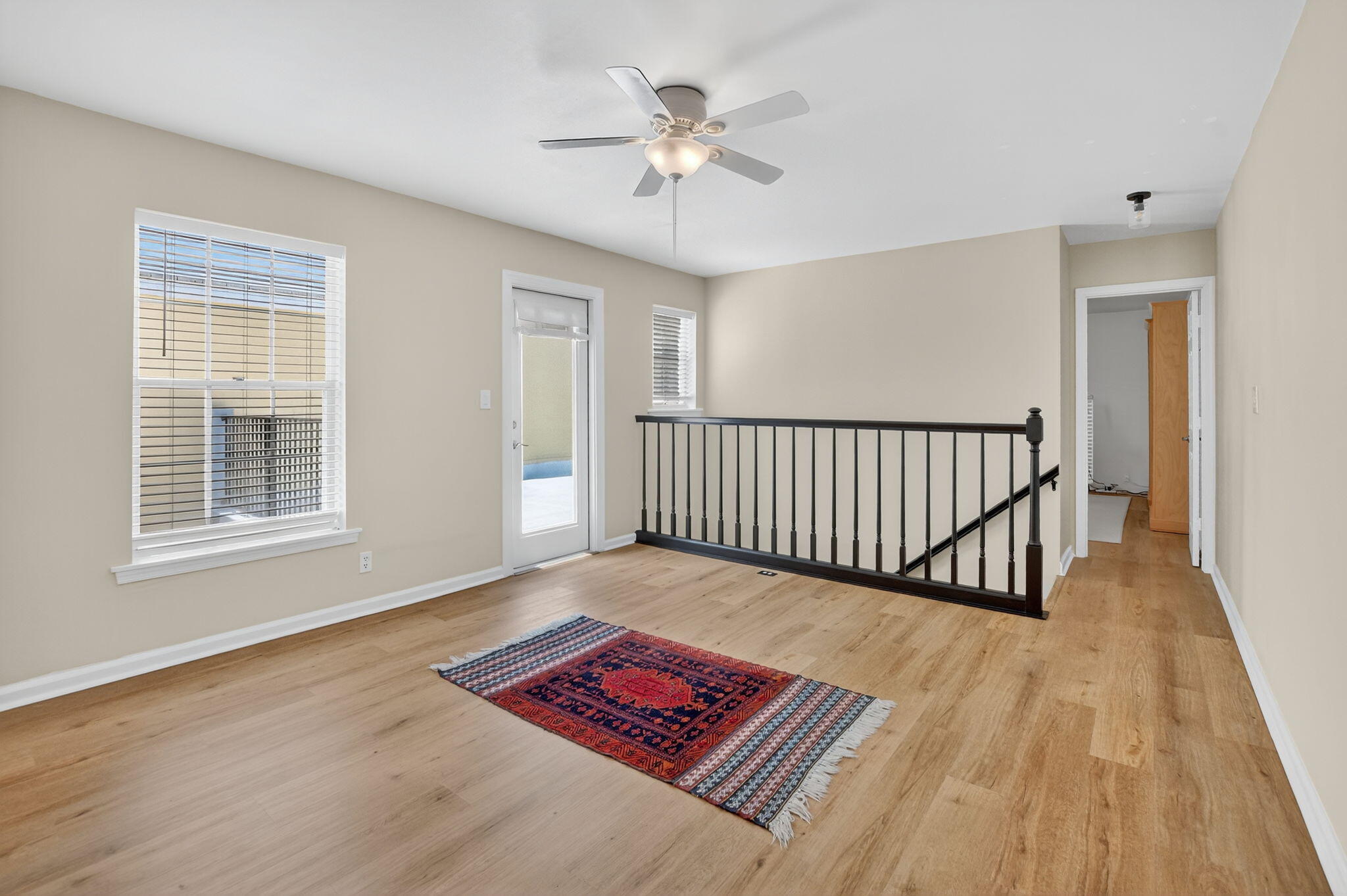 5908 Catesby Street Boca Raton, FL 33433 - Photo 21 of 49 a view of a room with wooden floor a chandelier and windows