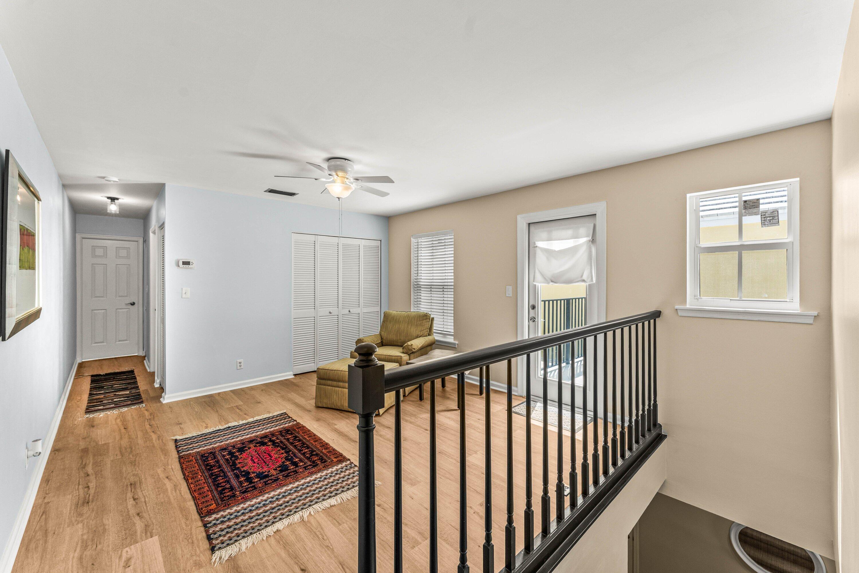 5908 Catesby Street Boca Raton, FL 33433 - Photo 22 of 49 a view of a hallway with windows and stairs