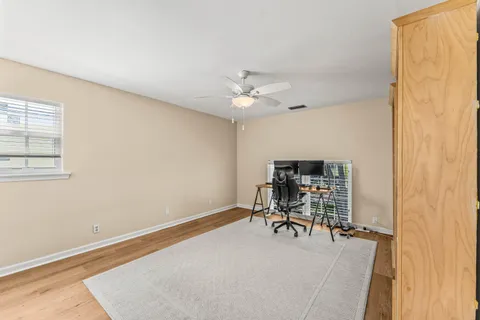 a work room with furniture and a window