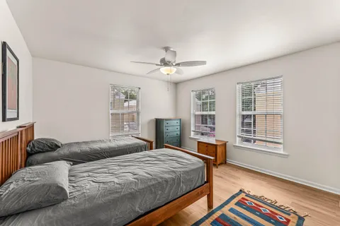 a bedroom with a large bed and a window