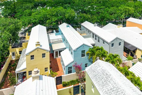a view of multiple house with large windows