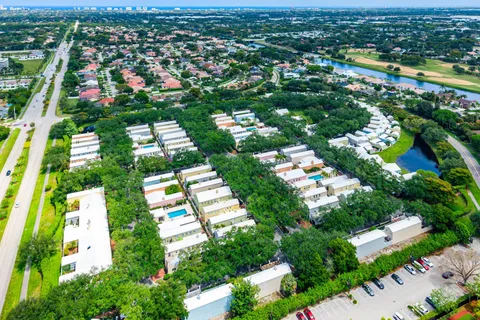 an aerial view of residential houses with outdoor space