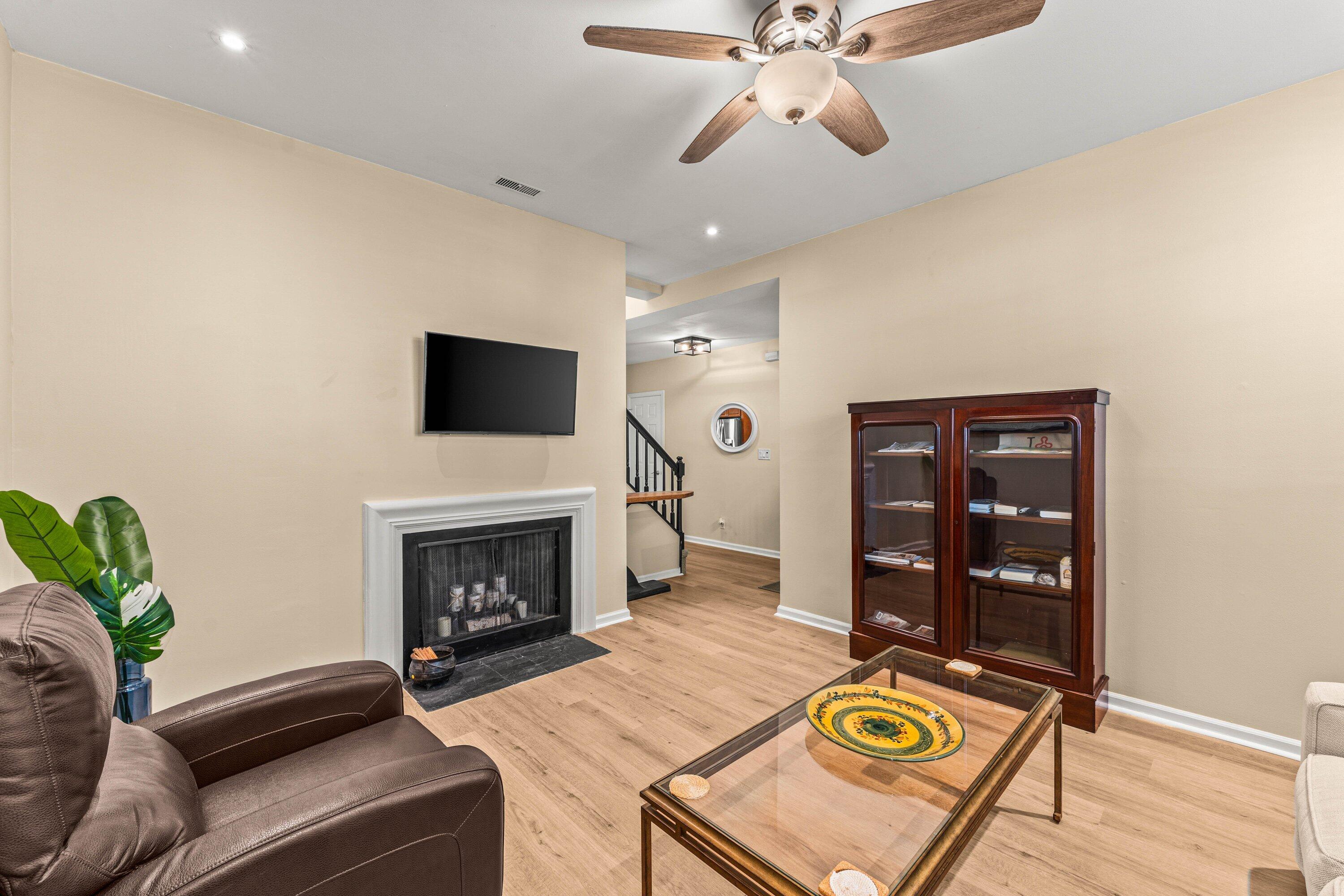 5908 Catesby Street Boca Raton, FL 33433 - Photo 9 of 49 a living room with furniture and a fireplace
