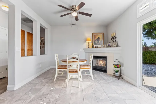 a dining room with furniture and a fireplace