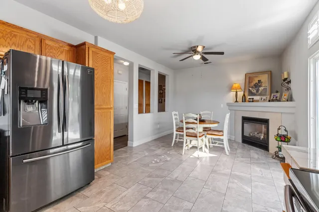 a kitchen with furniture a stove and a refrigerator