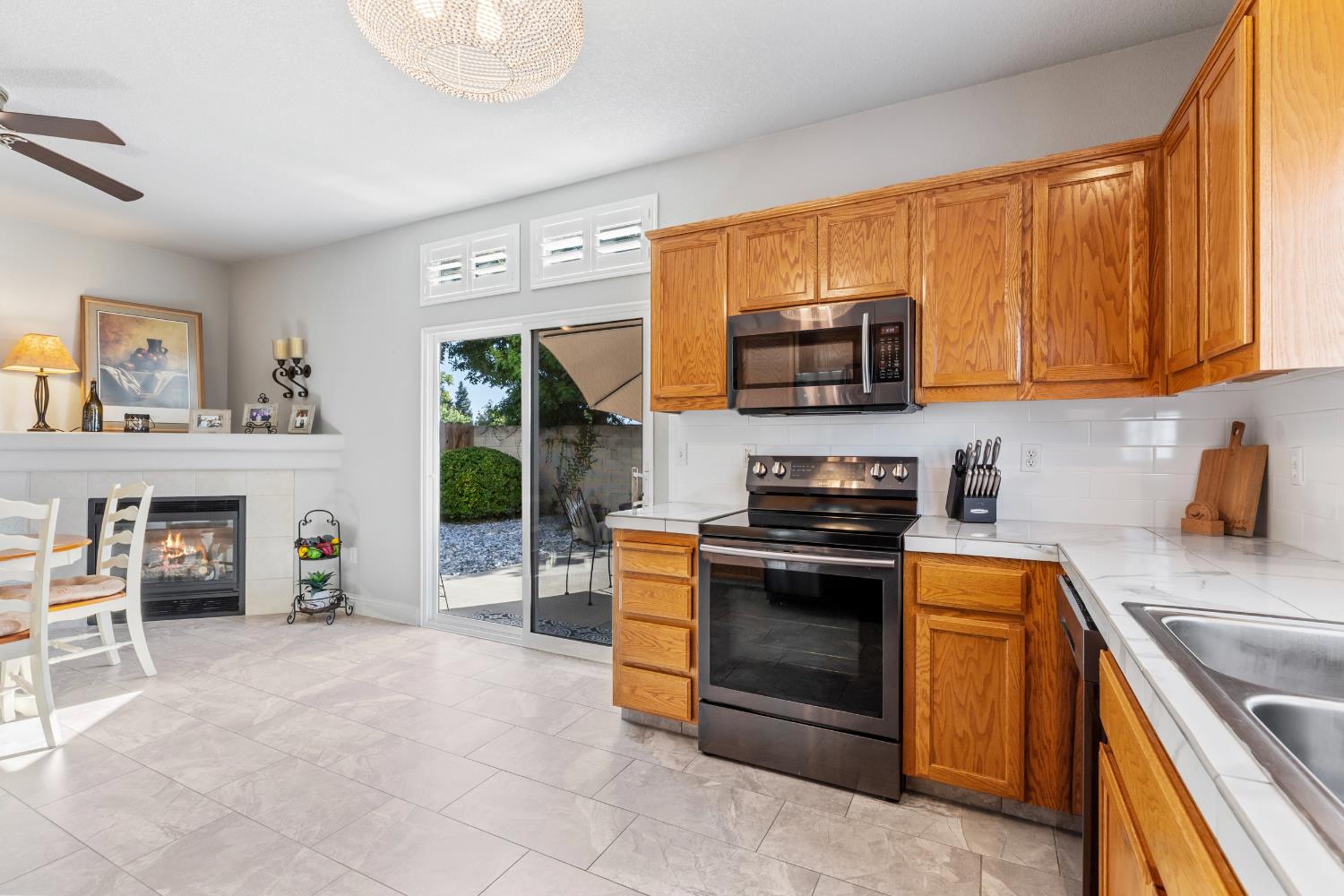 3300 Spring Garden Drive Turlock, CA 95382 - Photo 16 of 34 a kitchen with furniture a stove and a refrigerator