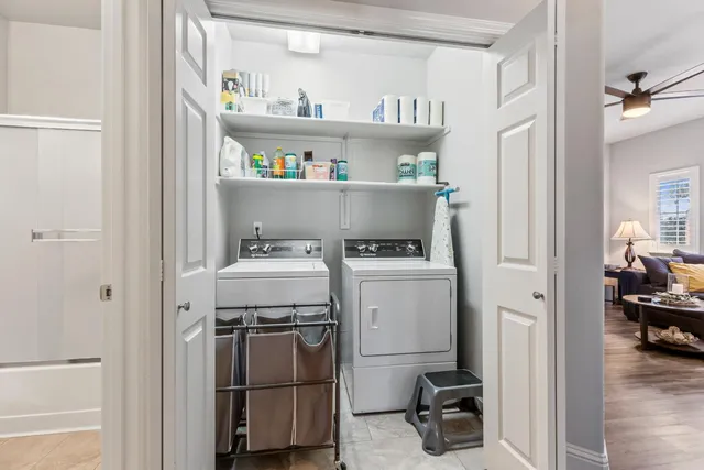 a view of a hallway with wooden floor and entryway