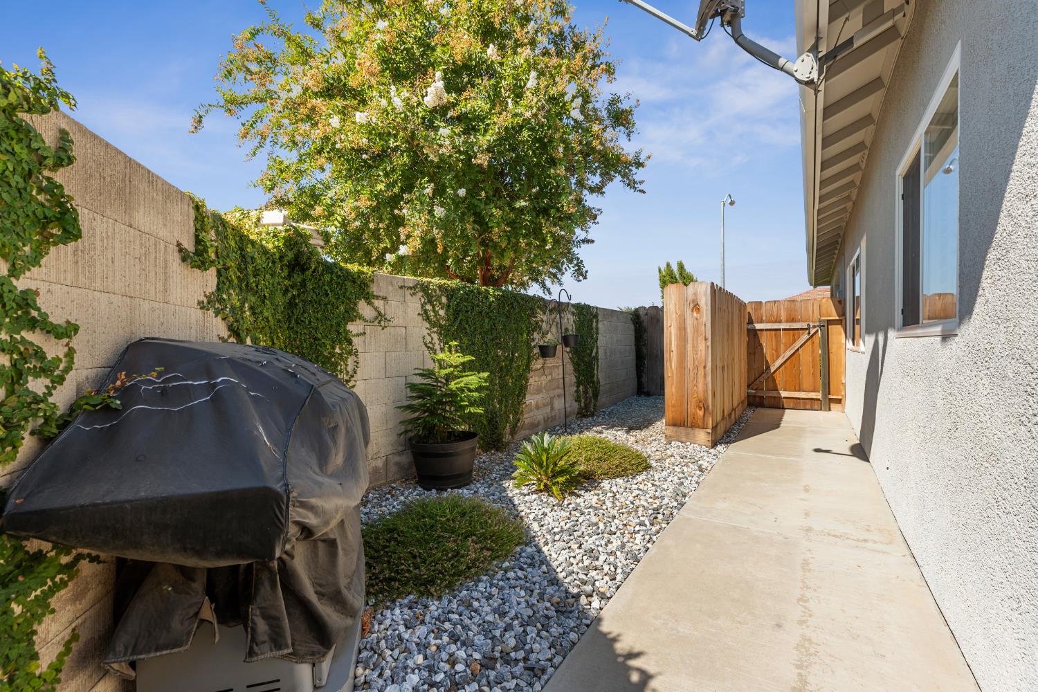 3300 Spring Garden Drive Turlock, CA 95382 - Photo 28 of 34 a view of a chairs and table in the backyard