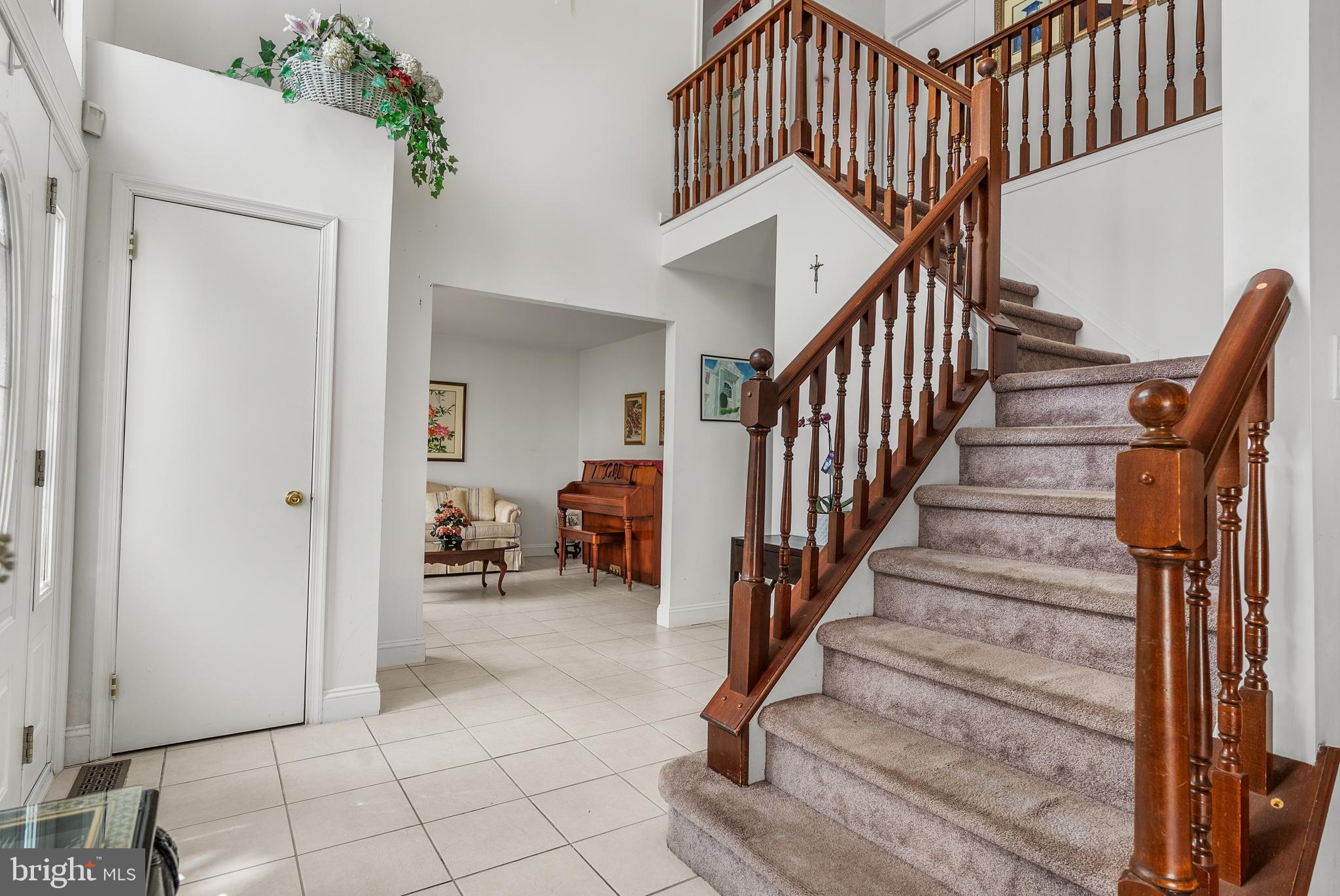 10 Winfield Circle Sewell, NJ 08080 - Photo 16 of 37 a view of staircase with white walls and railing