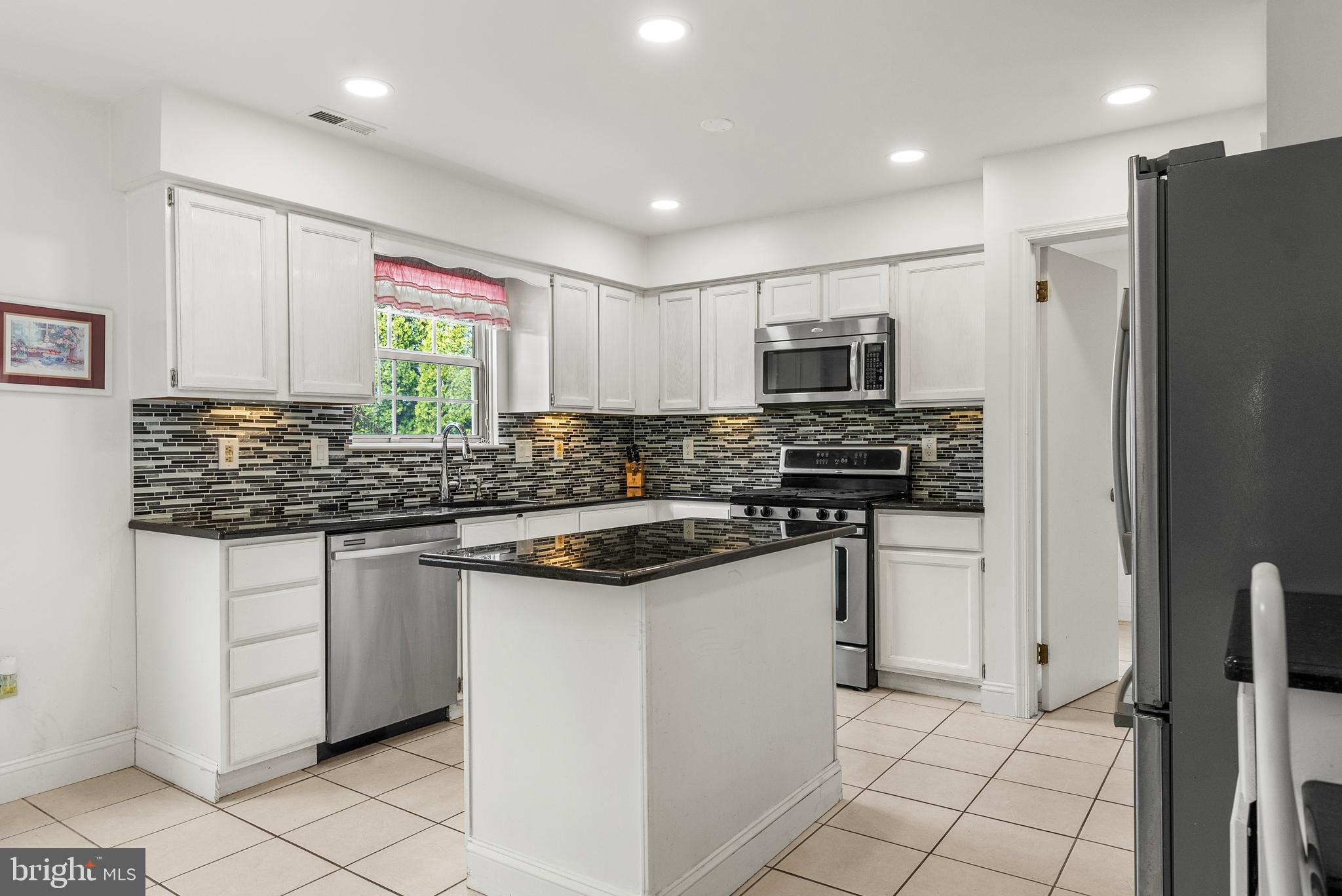 10 Winfield Circle Sewell, NJ 08080 - Photo 2 of 37 a kitchen with stainless steel appliances granite countertop a stove sink and refrigerator
