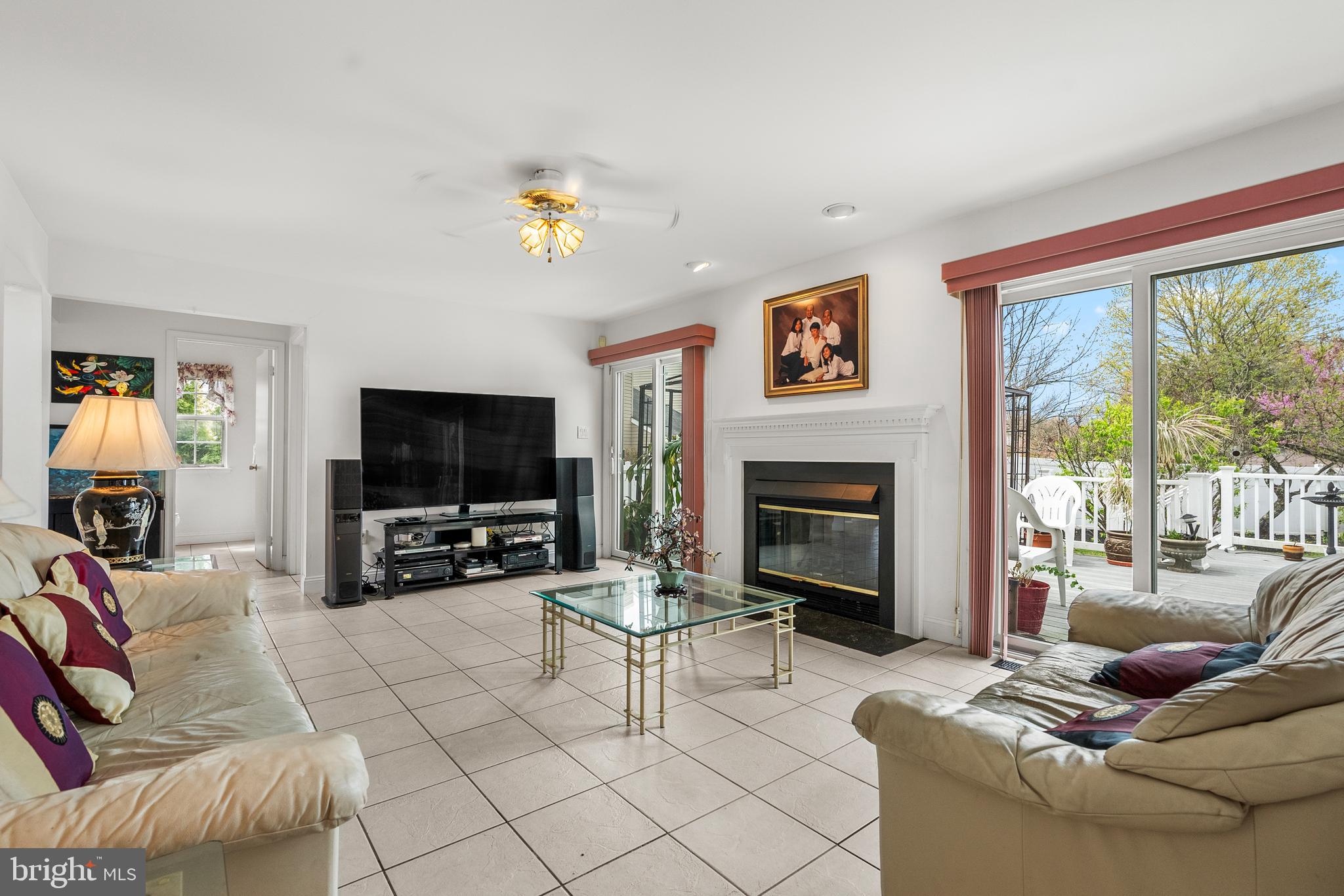 10 Winfield Circle Sewell, NJ 08080 - Photo 7 of 37 a living room with furniture a flat screen tv and a fireplace