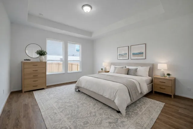 a bedroom with a bed and a dresser