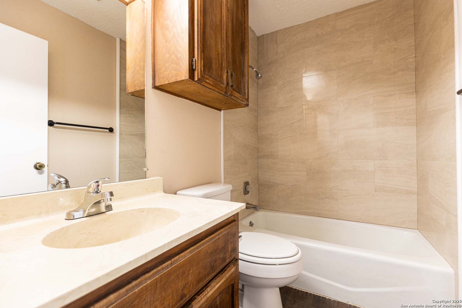 5814 Pineway Street San Antonio, TX 78247 - Photo 8 of 18 a bathroom with a sink a toilet and bathtub