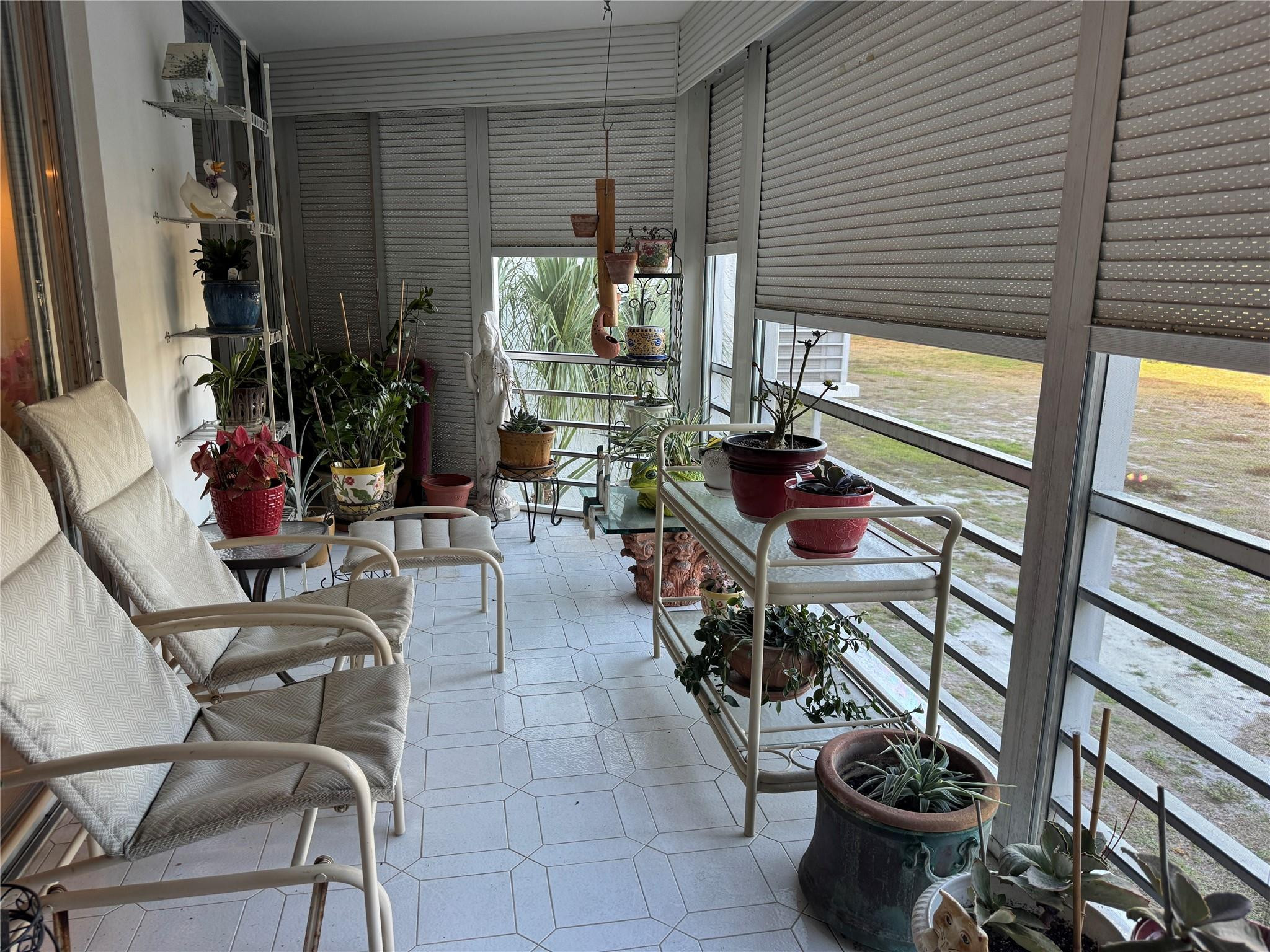 6000 Northwest 2nd Avenue, Unit 237 Boca Raton, FL 33487 - Photo 11 of 34 SCREENED PATIO WITH ROLLADENS