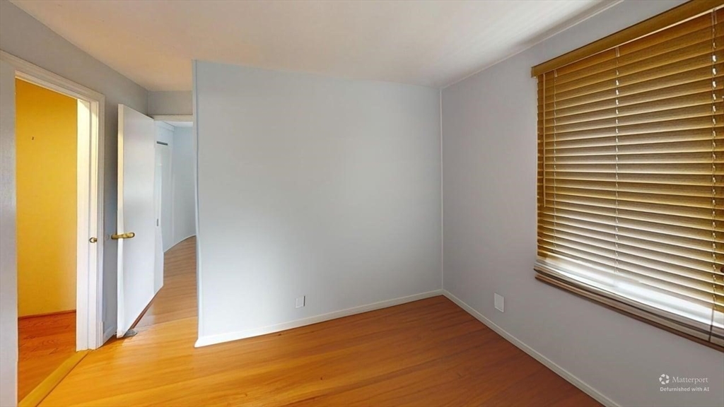 5 Douglas Lane Wareham, MA 02538 - Photo 11 of 15 a view of a room with wooden floor and a window