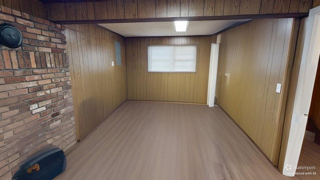 5 Douglas Lane Wareham, MA 02538 - Photo 12 of 15 a view of an empty room with wooden floor and a window