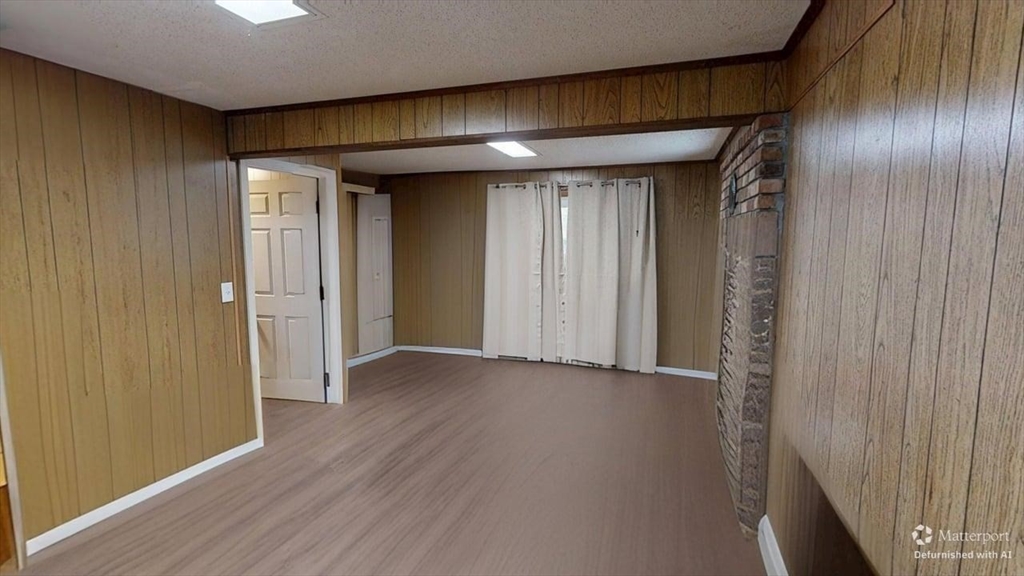 5 Douglas Lane Wareham, MA 02538 - Photo 13 of 15 an empty room with wooden floor and windows