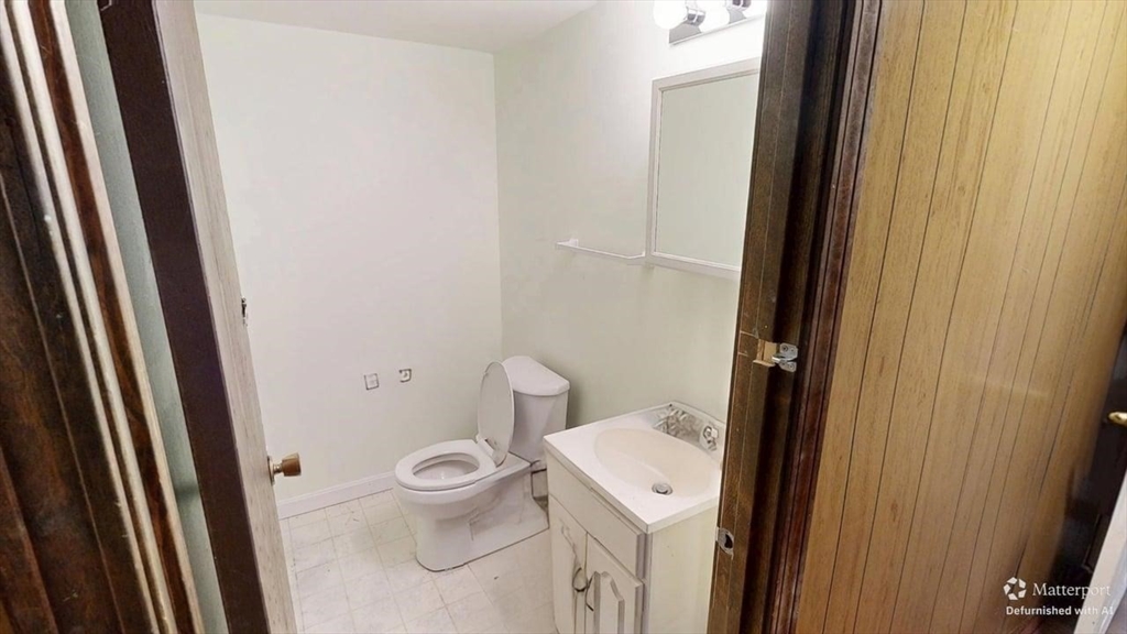 5 Douglas Lane Wareham, MA 02538 - Photo 14 of 15 a bathroom with a granite countertop toilet and a sink