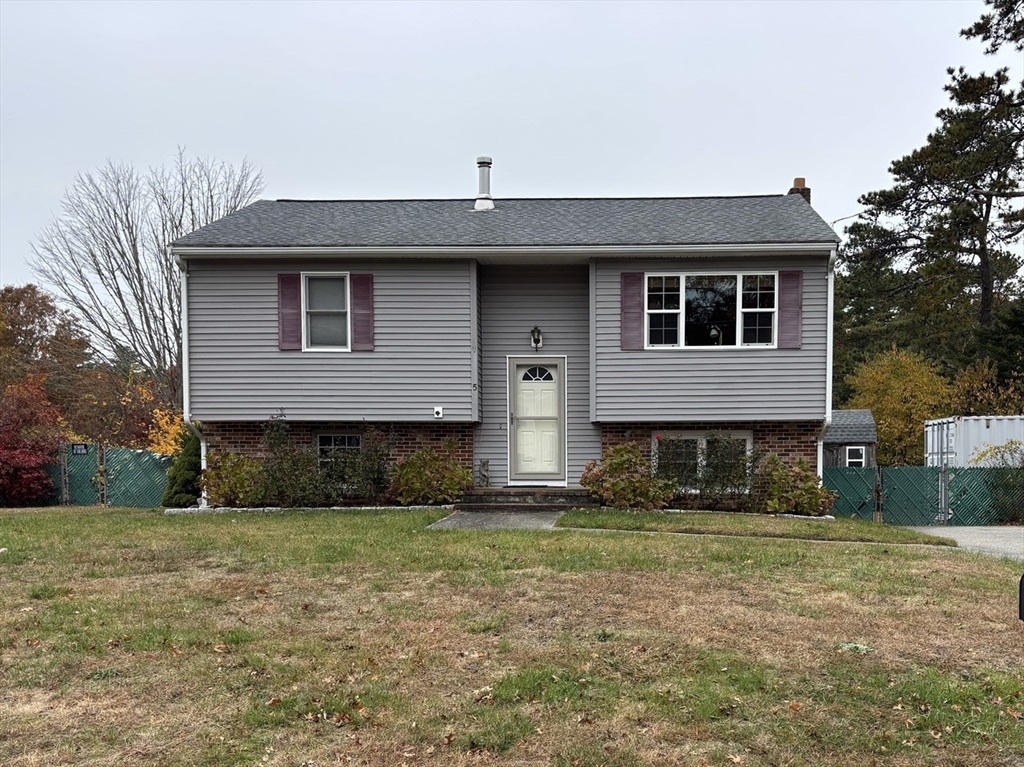 5 Douglas Lane Wareham, MA 02538 - Photo 2 of 15 a front view of a house with a yard