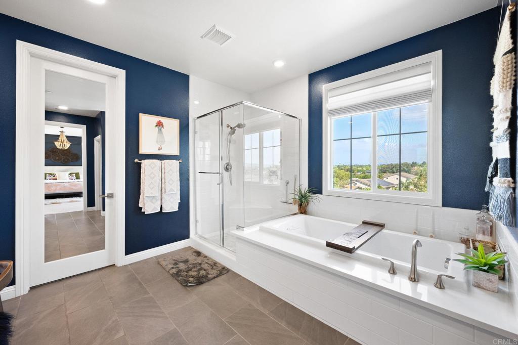 1211 Tesoro Place Vista, CA 92081 - Photo 37 of 57 a living room with a large window and a table