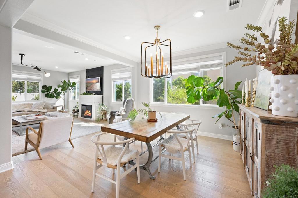 1211 Tesoro Place Vista, CA 92081 - Photo 5 of 57 a view of a dining room with furniture and a potted plant