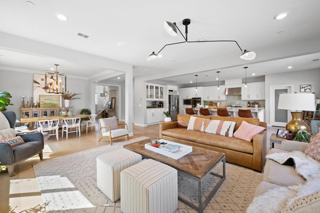 1211 Tesoro Place Vista, CA 92081 - Photo 10 of 57 a living room with lots of furniture and kitchen view