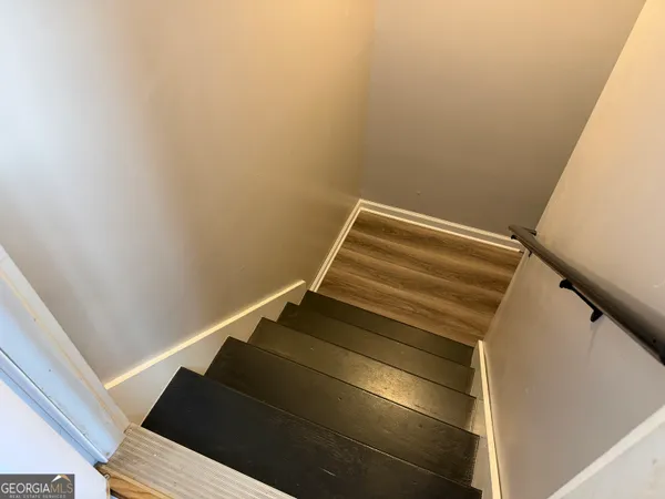 a view of entryway with wooden floor