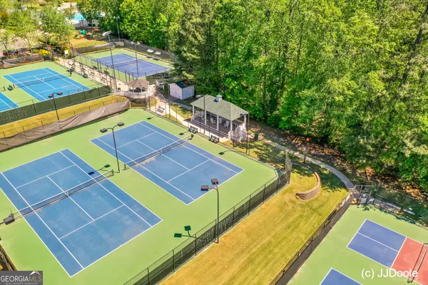 a view of an outdoor space and tennis court