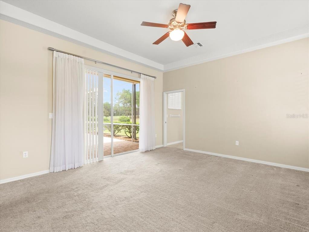 9037 Penelope Drive Weeki Wachee, FL 34613 - Photo 29 of 60 wooden floor in an empty room with a window