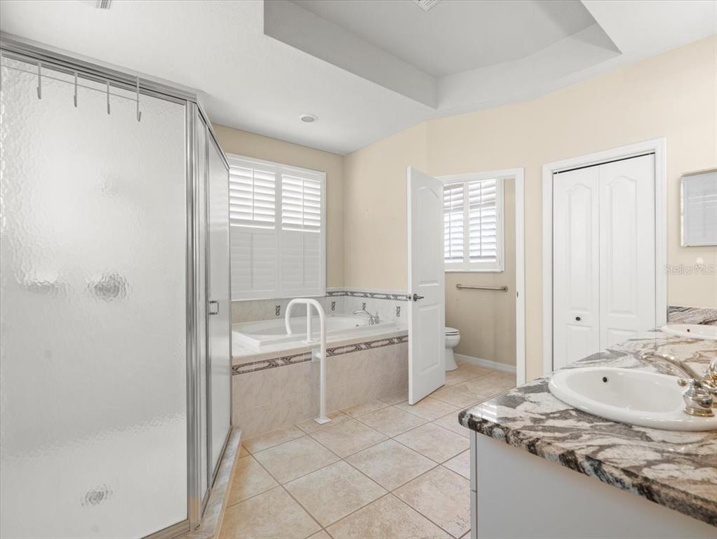 9037 Penelope Drive Weeki Wachee, FL 34613 - Photo 31 of 60 a bathroom with a sink toilet and shower