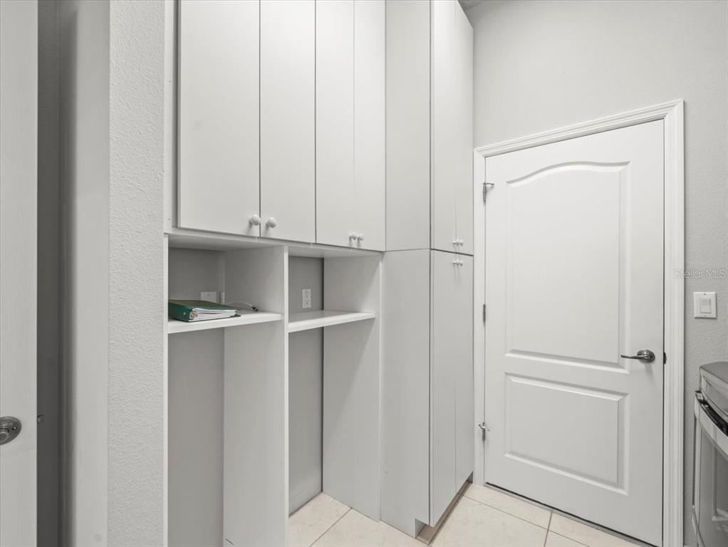 9037 Penelope Drive Weeki Wachee, FL 34613 - Photo 39 of 60 a view of walk in closet with empty racks