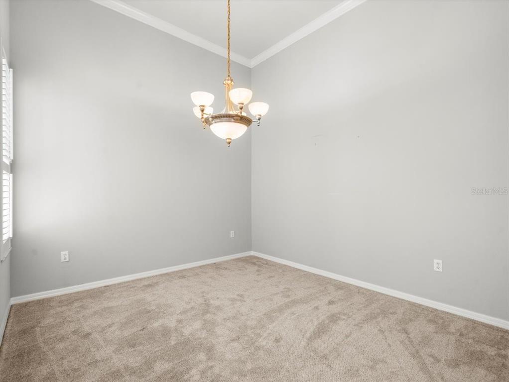 9037 Penelope Drive Weeki Wachee, FL 34613 - Photo 8 of 60 a view of empty room with wooden floor