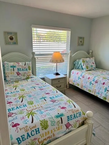 a bed sitting in a room next to a window