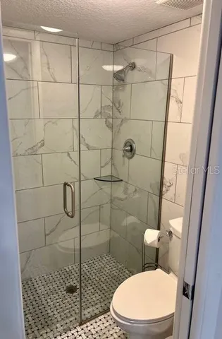 a yellow house with garden in front of it